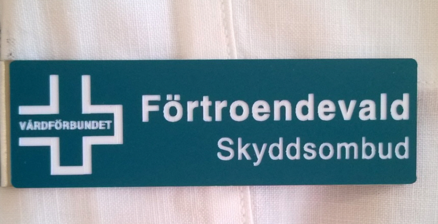 Skylt med text förtroendevald, skyddsombud